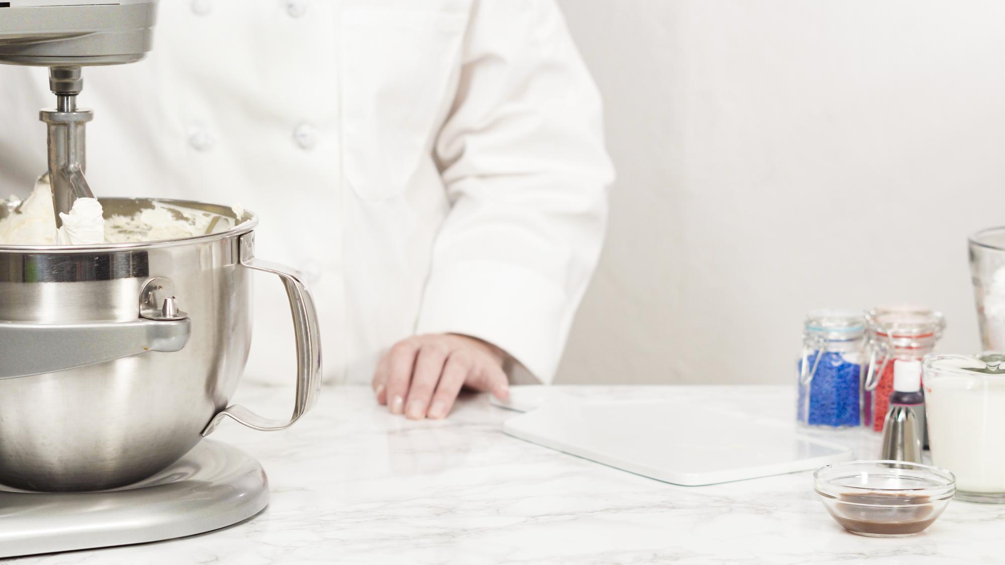 Modern test kitchen with stainless equipment and recipe notes