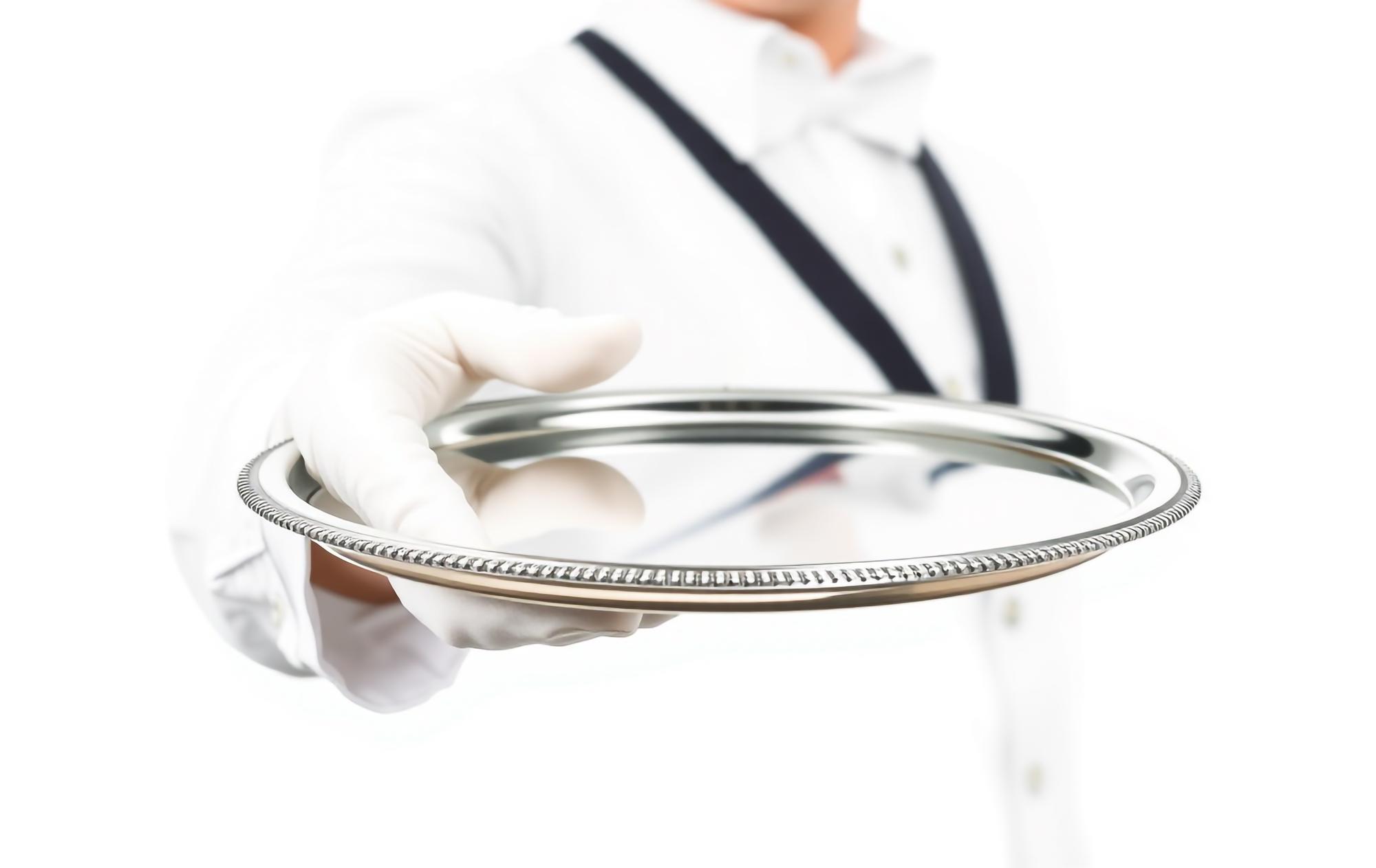 Chef preparing plated futuristic dish with precise tools